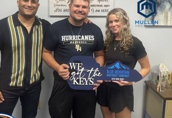 Alex Atamian with clients on closing day