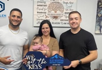 Alex Atamian with clients on closing day
