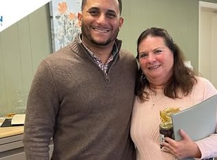 Alex Atamian with clients on closing day